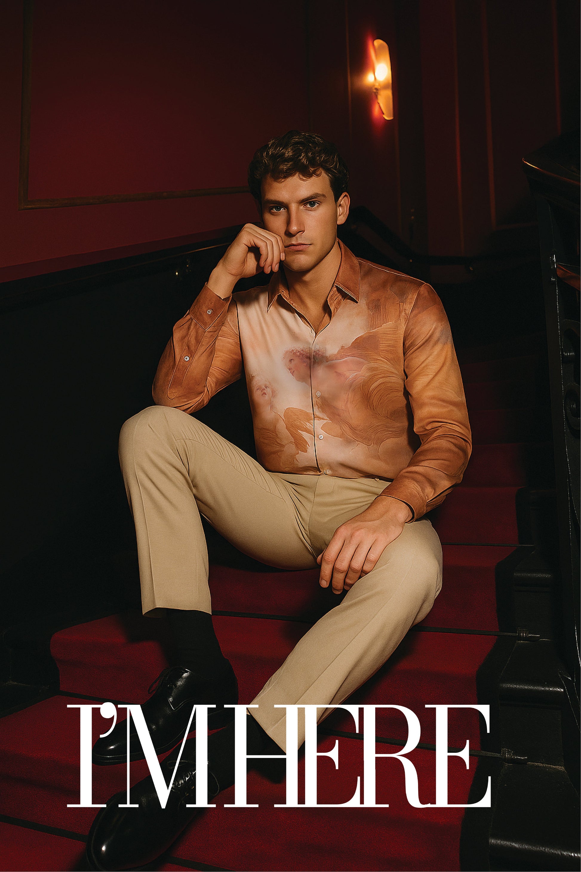Stylera luxury art print men's shirt brown floral print on model seated on red stairs with beige pants