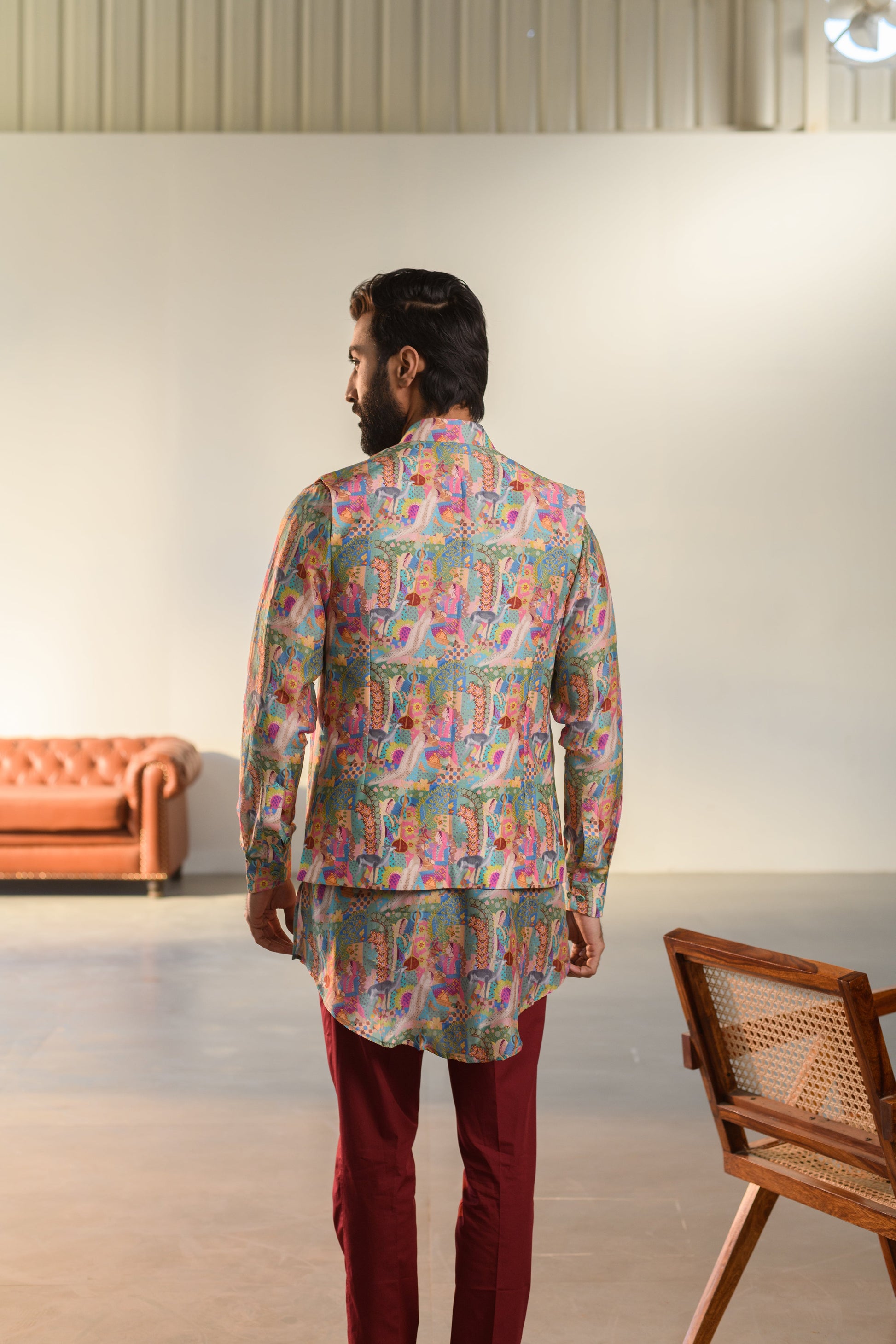 Man wearing a vibrant Kurta Jacket Set from Stylera, showcasing luxury ethnic wear for men