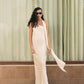Stylera luxury long gown in cream satin with halter neck and flowing scarf detail