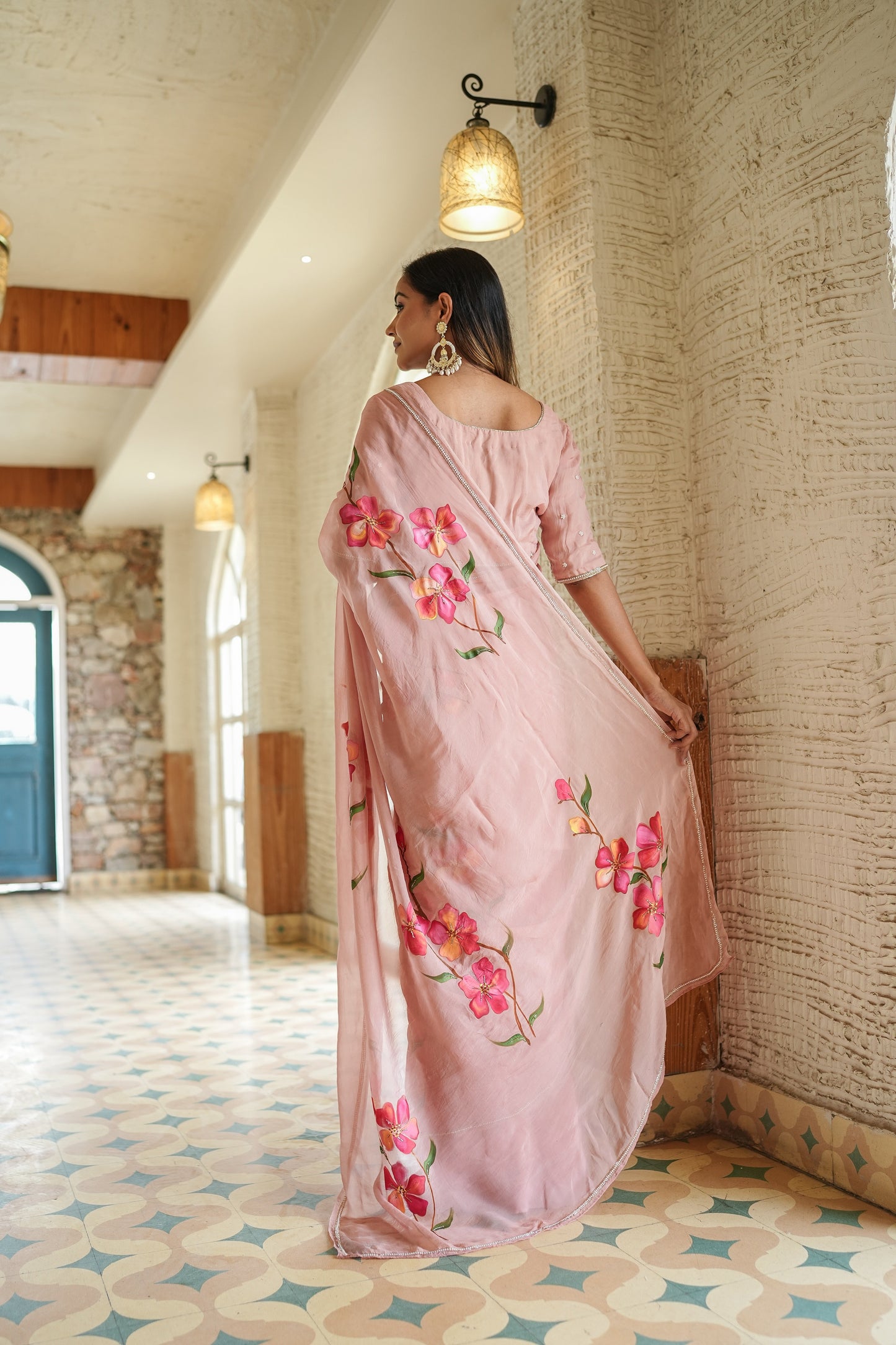 Elegant Stylera luxury statement saree for special occasions featuring floral embroidery in a soft pink shade
