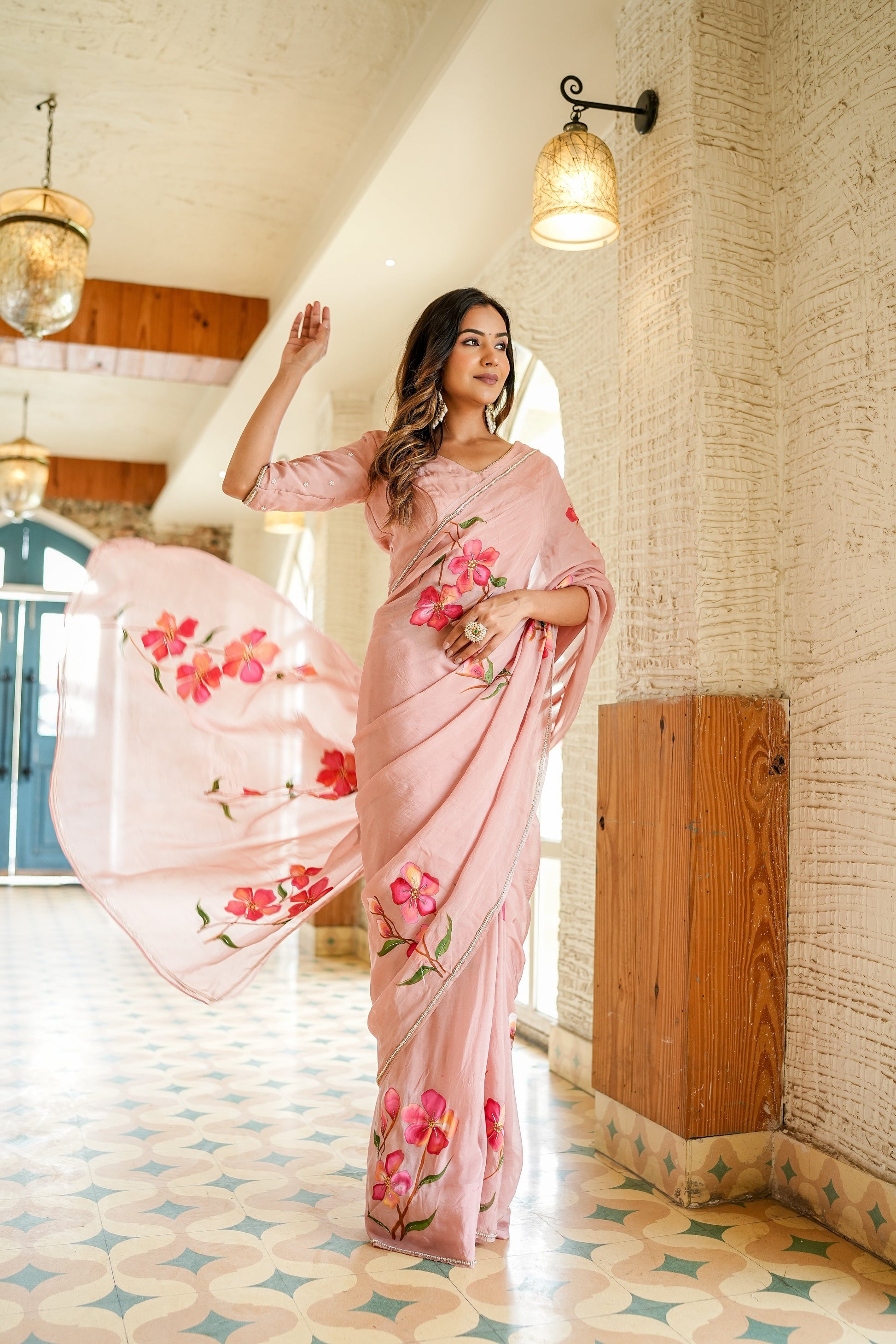 Elegant luxury statement saree for special occasions featuring floral designs and soft draping