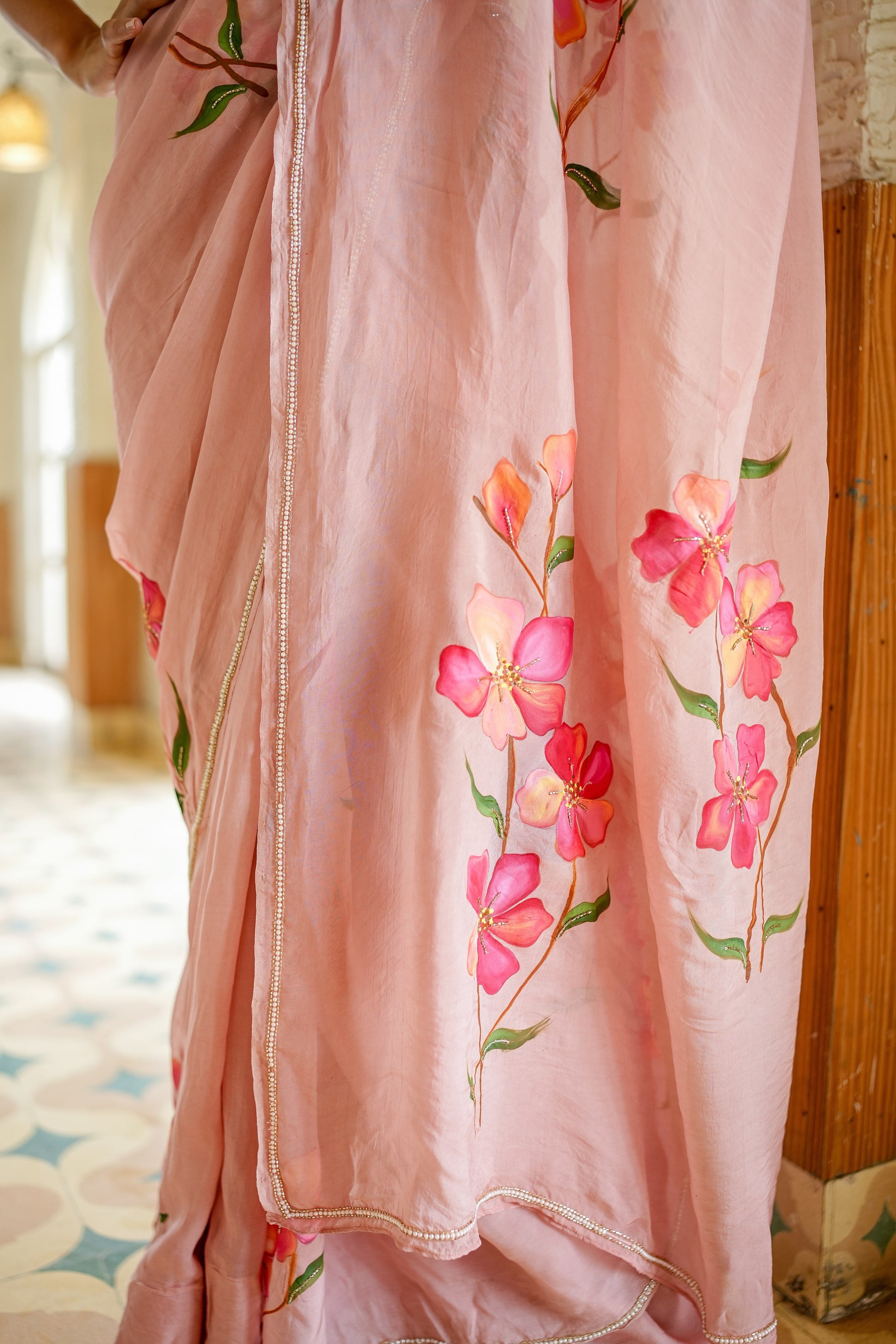 Elegant luxury statement saree for special occasions with floral embroidery in soft pink hues