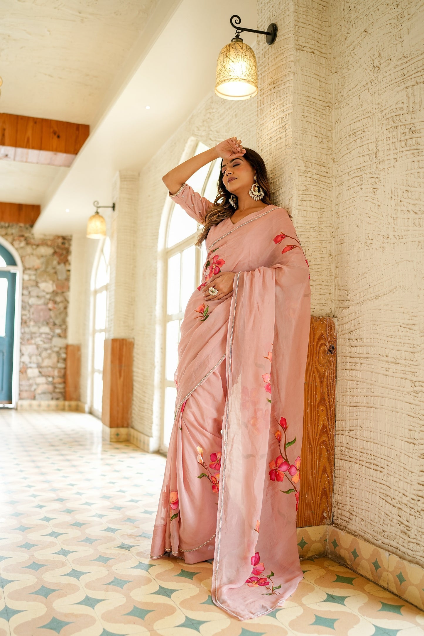 Elegant pink luxury statement saree for special occasions featuring floral embroidery and soft drape