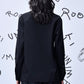 Back view of black Mad Hatter wool shirt by Stylera long sleeve tailored design on model