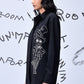 Stylera black button down shirt with white illustration on side modeled in profile Mad Hatter wool shirt
