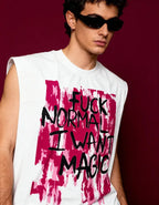 Person wearing a sleeveless shirt with a bold text design on a dark background