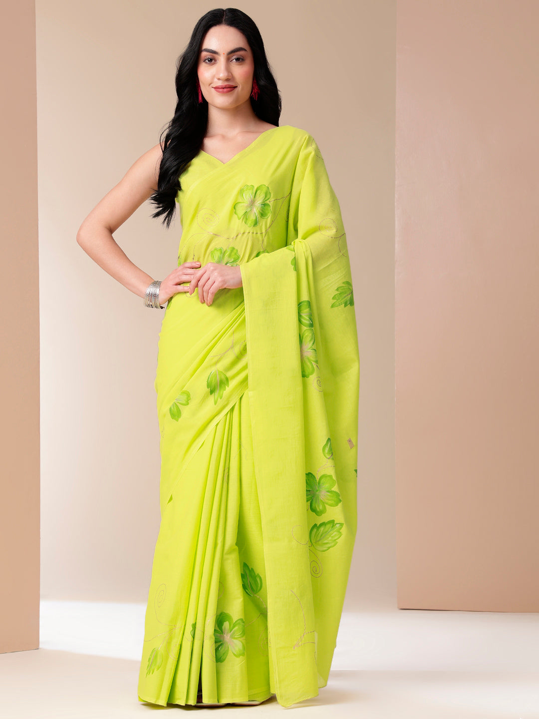 Bright green mal mal saree for women with floral embroidery, perfect for festive occasions