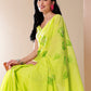 Vibrant Stylera mal mal saree for women in bright green with floral prints, perfect for casual wear