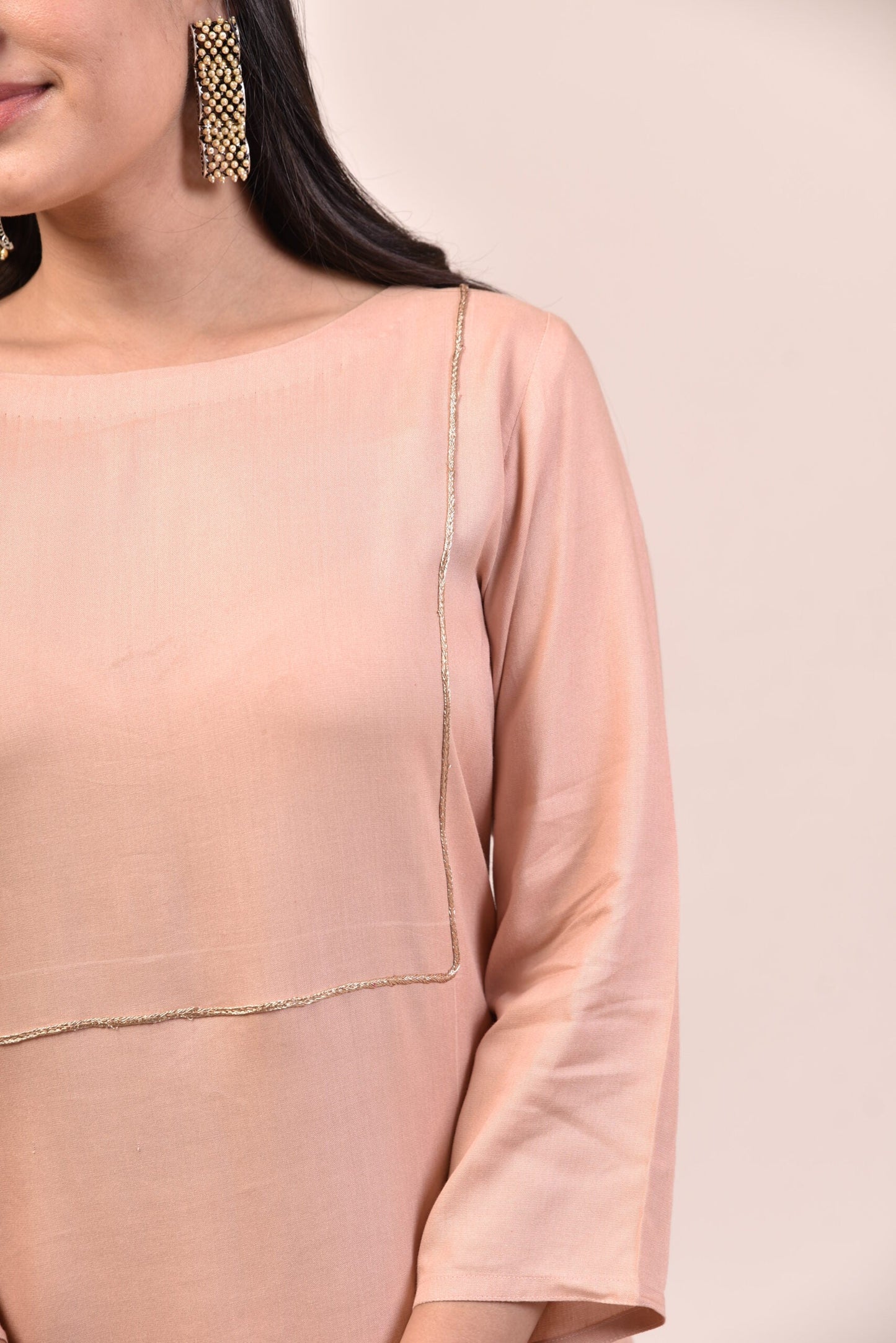 Elegant mauve pink kurta palazzo set featuring delicate finishing and stylish design