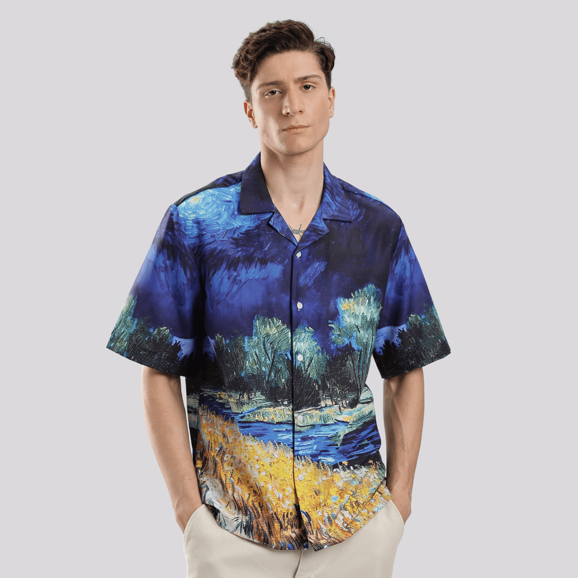 Model wearing Stylera men's artistic print shirt short sleeve button down with vibrant blue landscape design