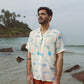 Men's cream oversize shirt with colorful print, perfect for beach outings or casual wear