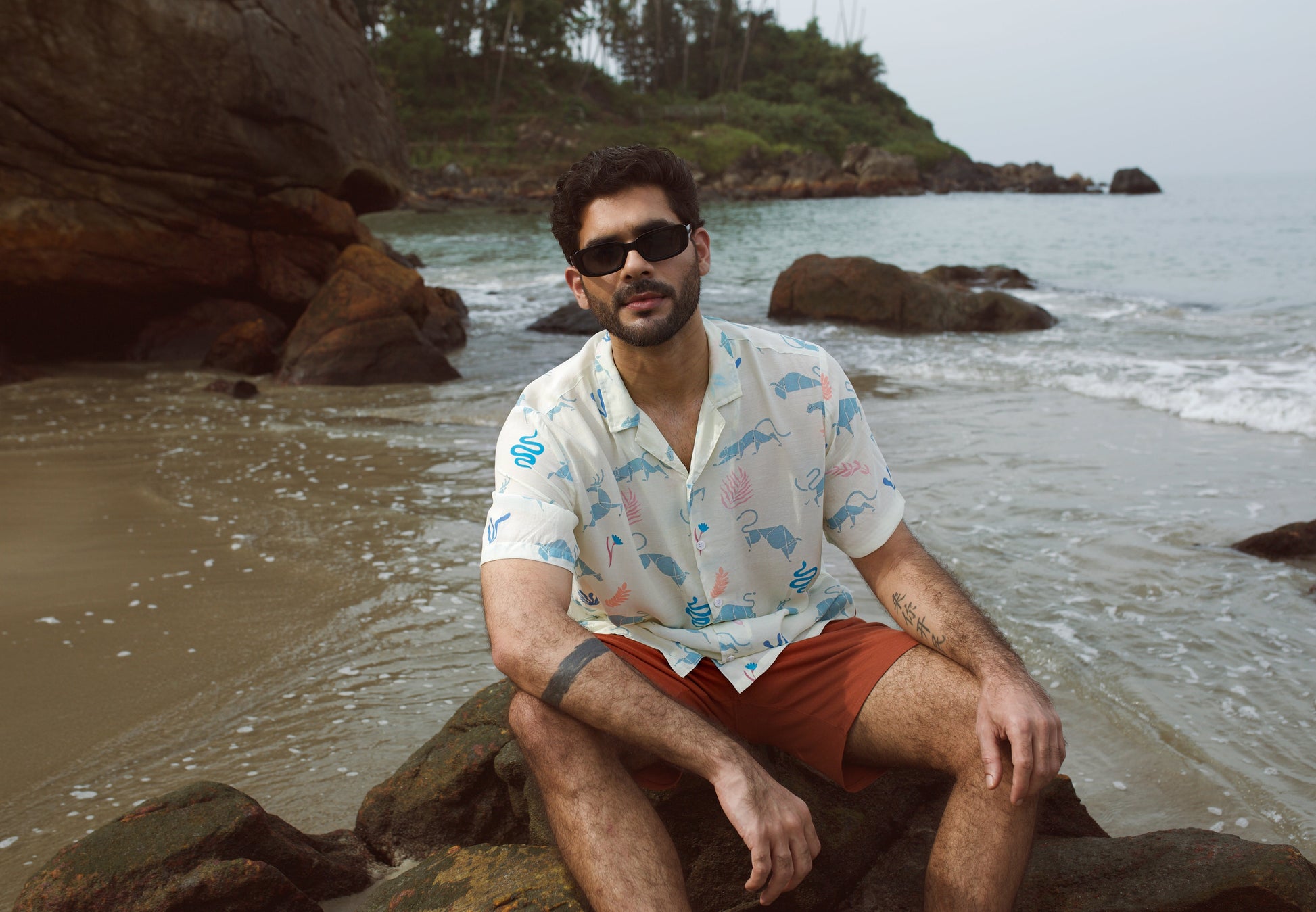 Men's cream oversize shirt with playful dinosaur prints, perfect for beach outings and casual wear