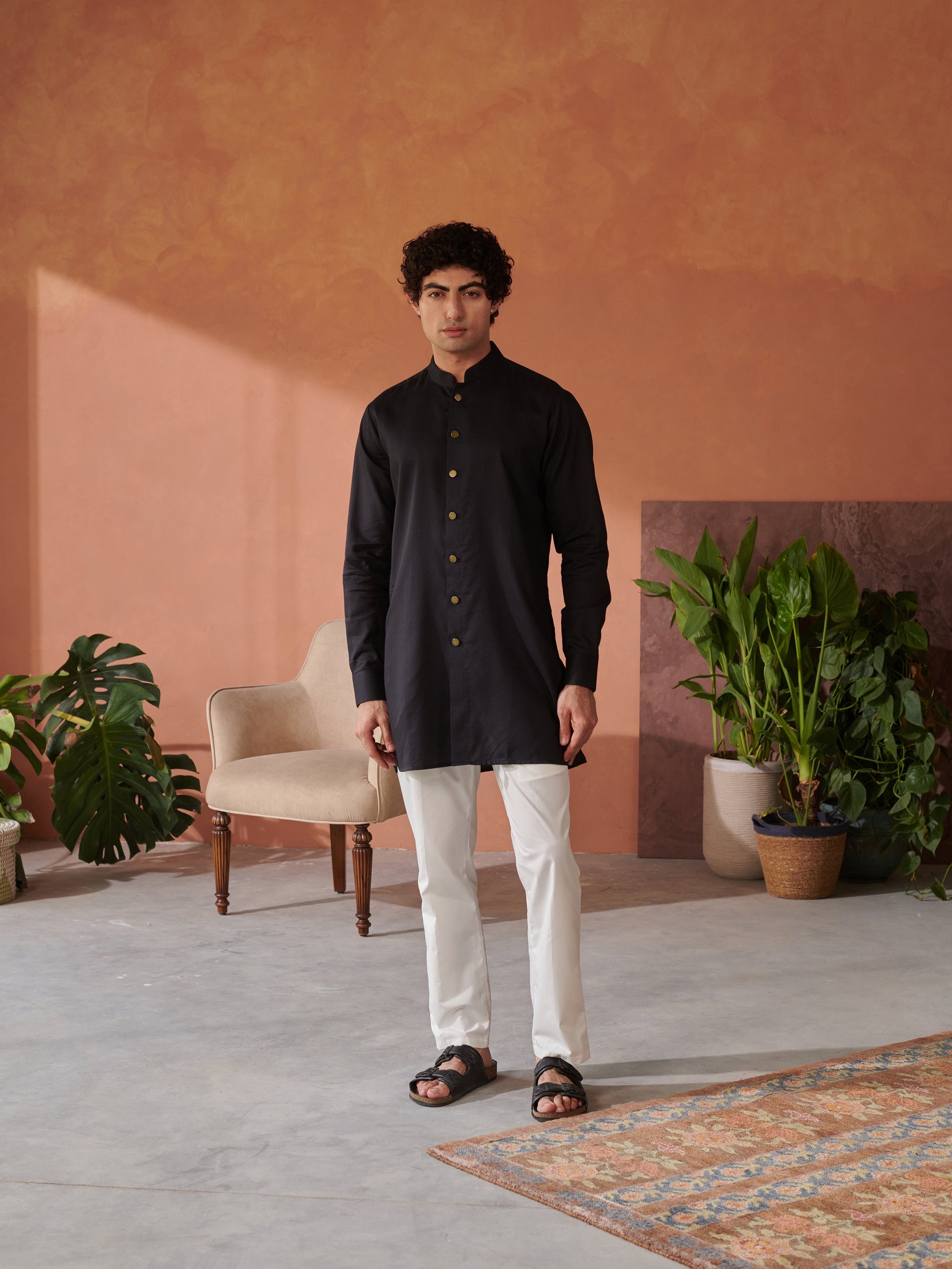 Stylish mens designer Jodhpuri kurta in black by Stylera with gold buttons and a contemporary fit