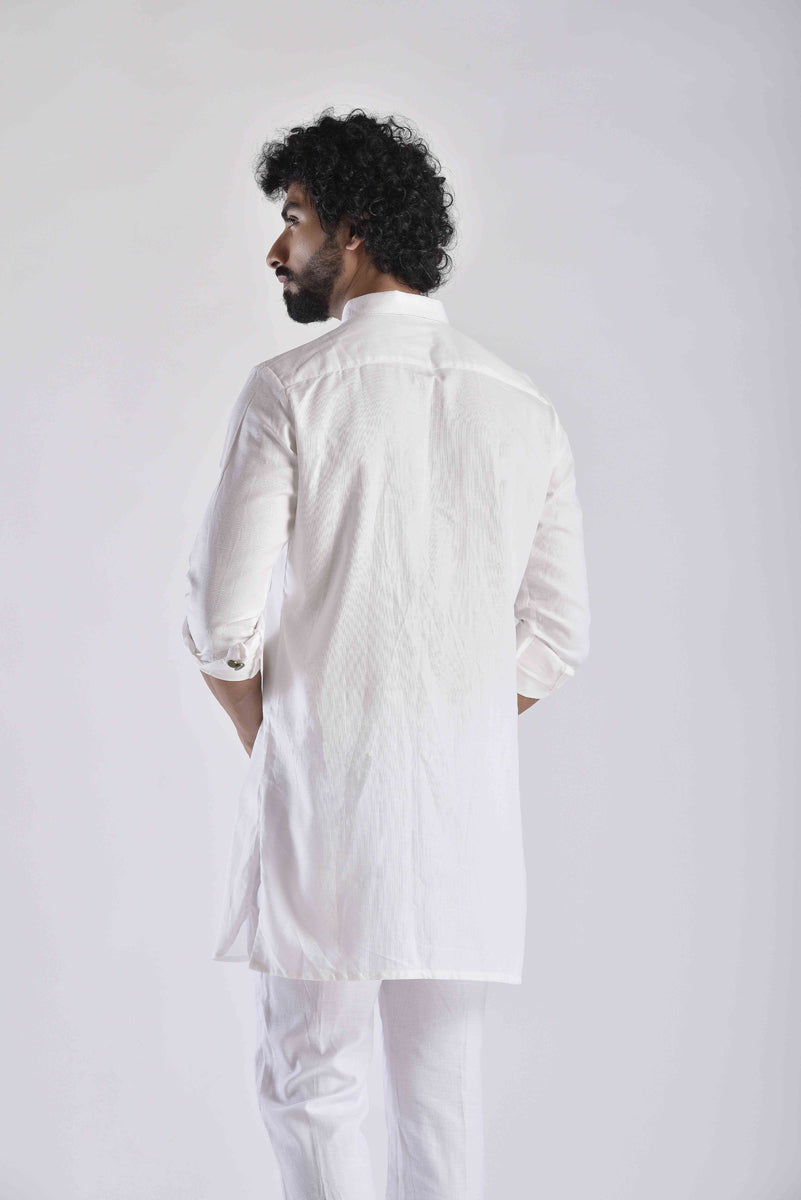 Men's ethnic kurta pant set in white, featuring a stylish back design and rolled sleeves