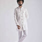 Men's ethnic kurta pant set in white with button details, perfect for festive occasions