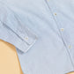 Light blue men's formal dotted shirt with button-down collar and long sleeves