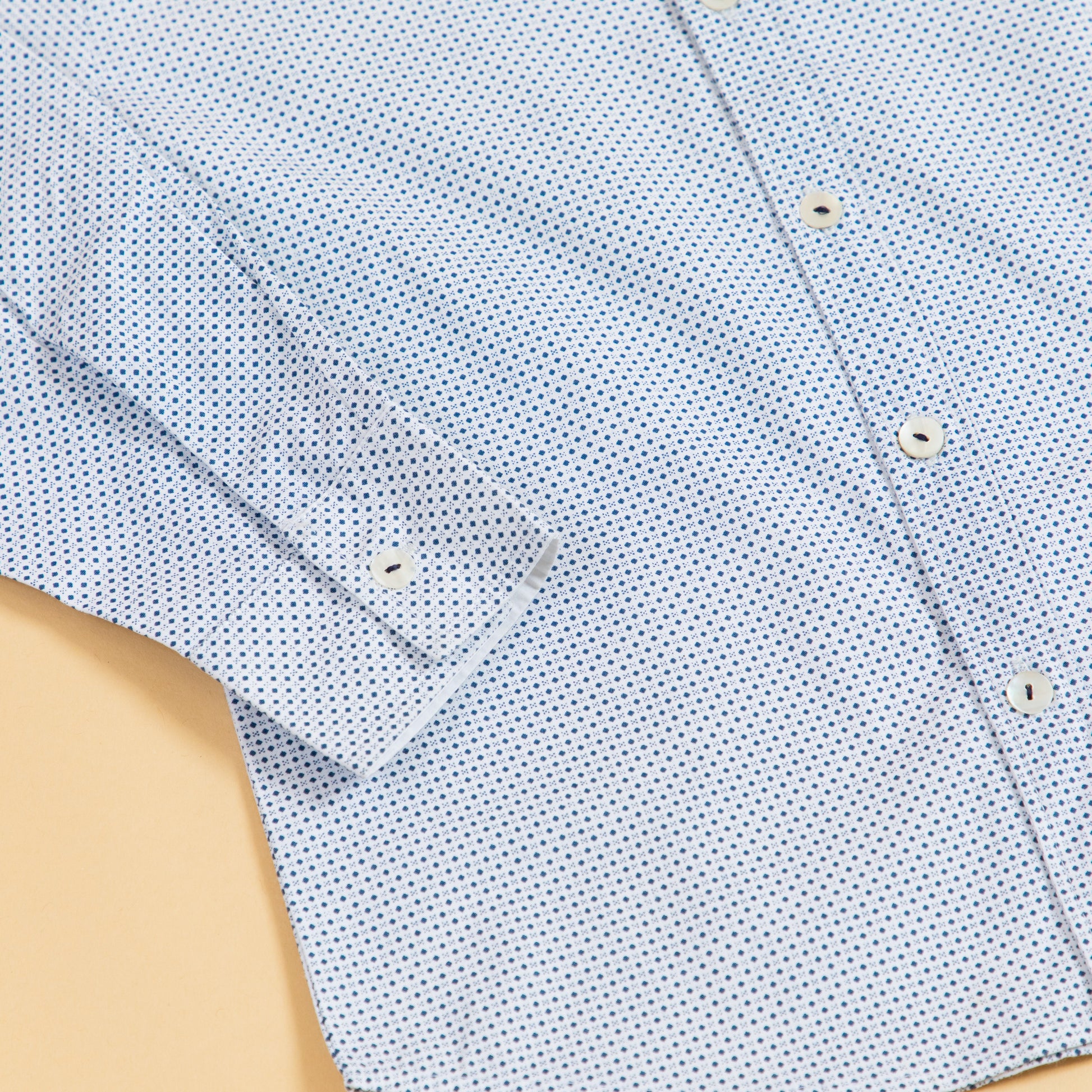 Light blue men's formal dotted shirt with button-down collar and long sleeves