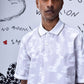 Mens ikkat print polo T-shirt by Stylera in white with subtle heart patterns