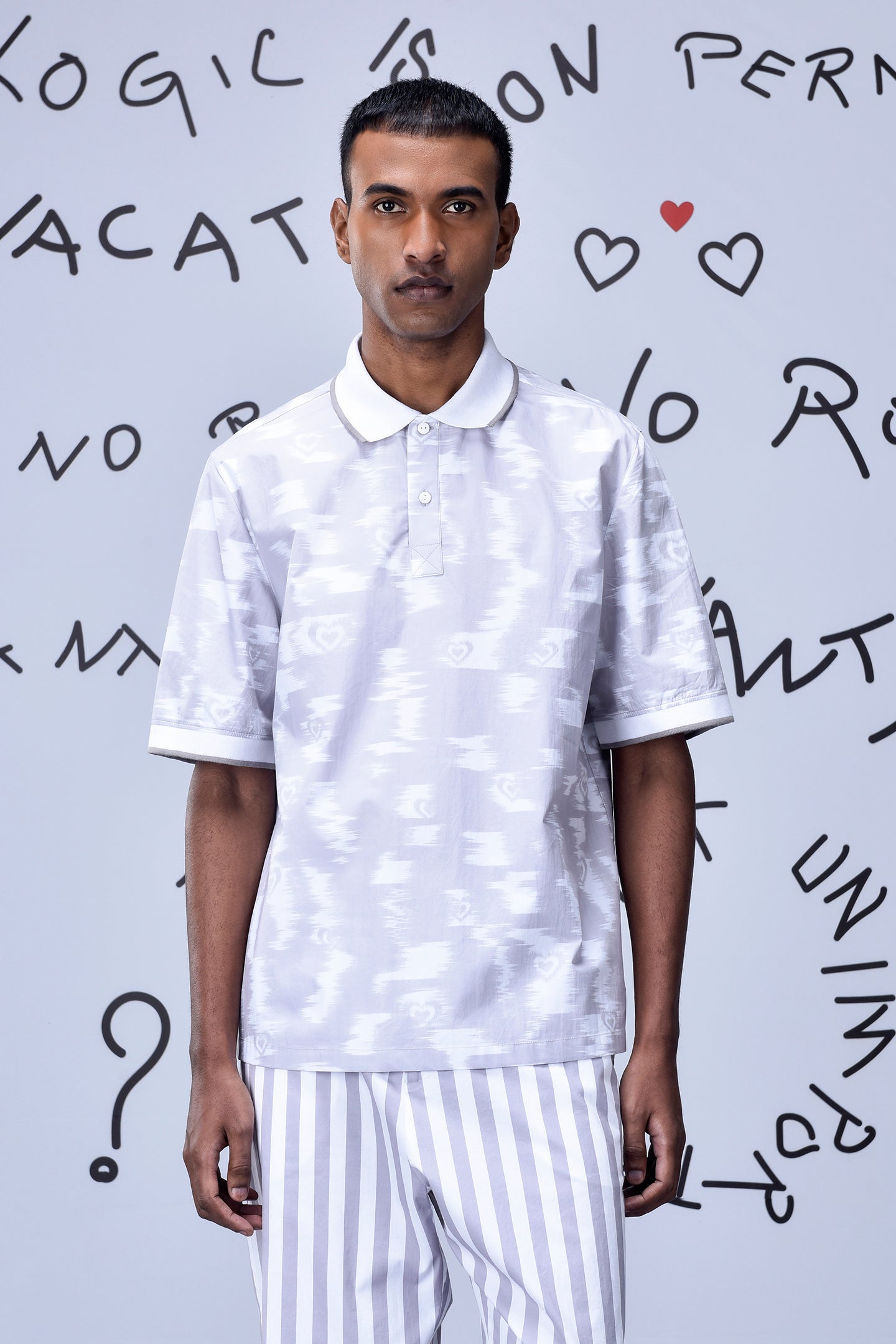 Men wearing Stylera mens ikkat print polo in white with subtle geometric patterns