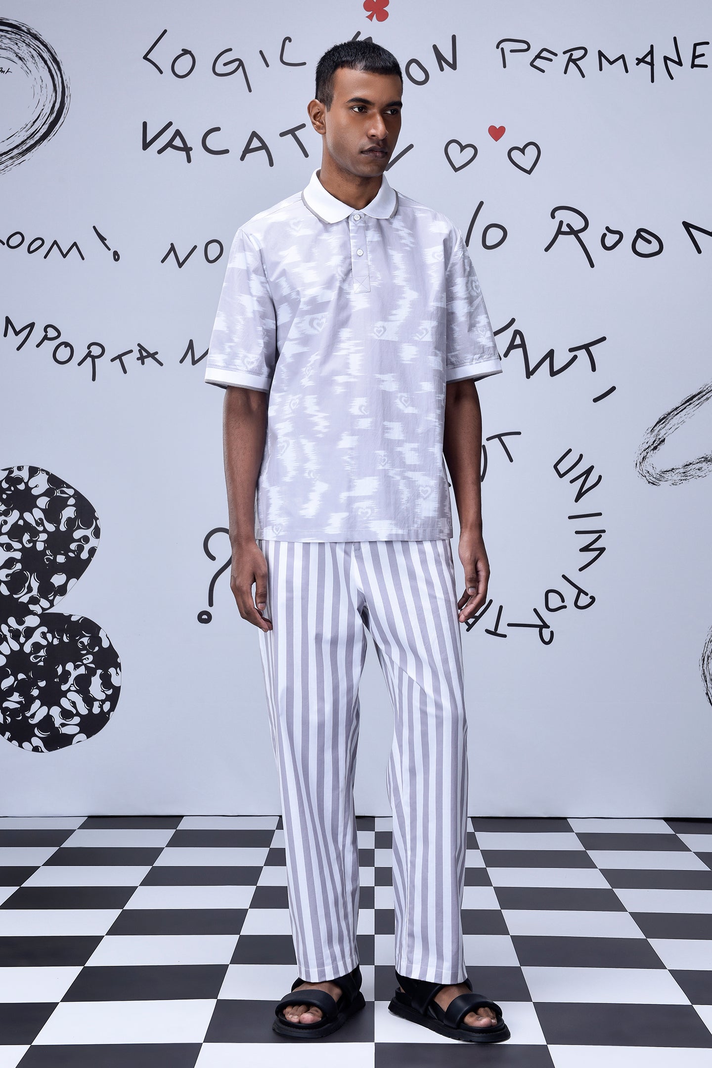 Men wearing Stylera mens ikkat print polo in light color with striped pants