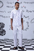 Men wearing Stylera mens ikkat print polo in light color with striped pants
