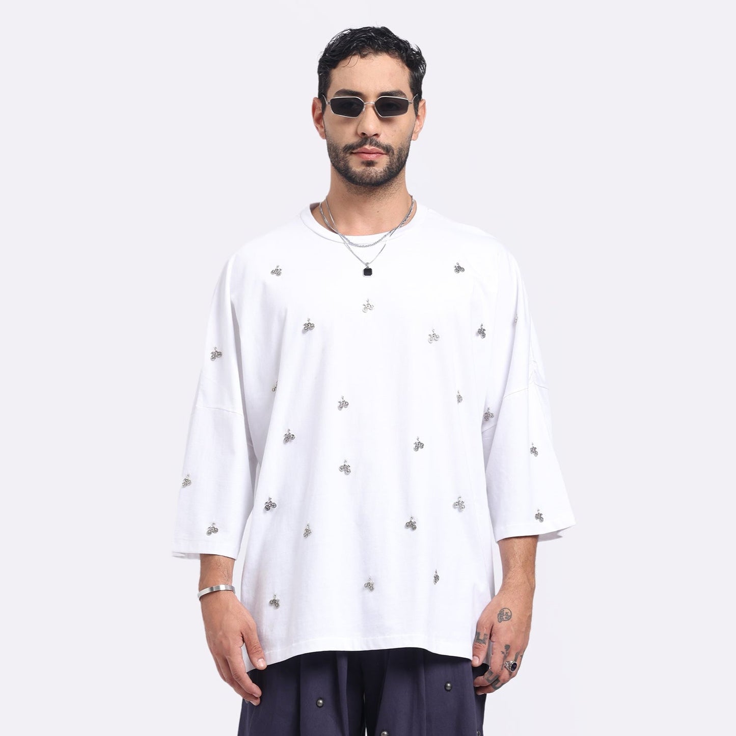 Stylera men's loose fit white t-shirt featuring a stylish design with unique embellishments