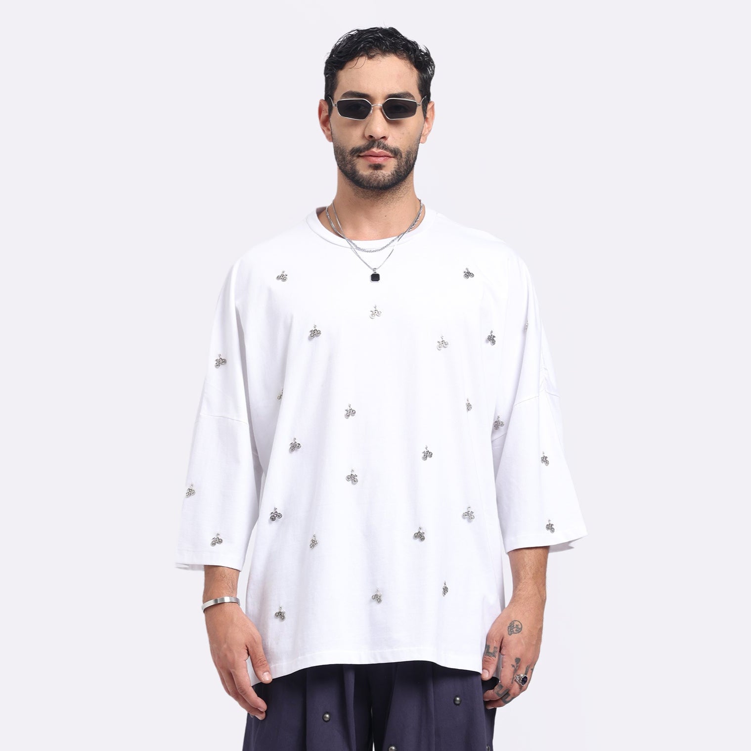Stylera men's loose fit white t-shirt featuring a stylish design with unique embellishments