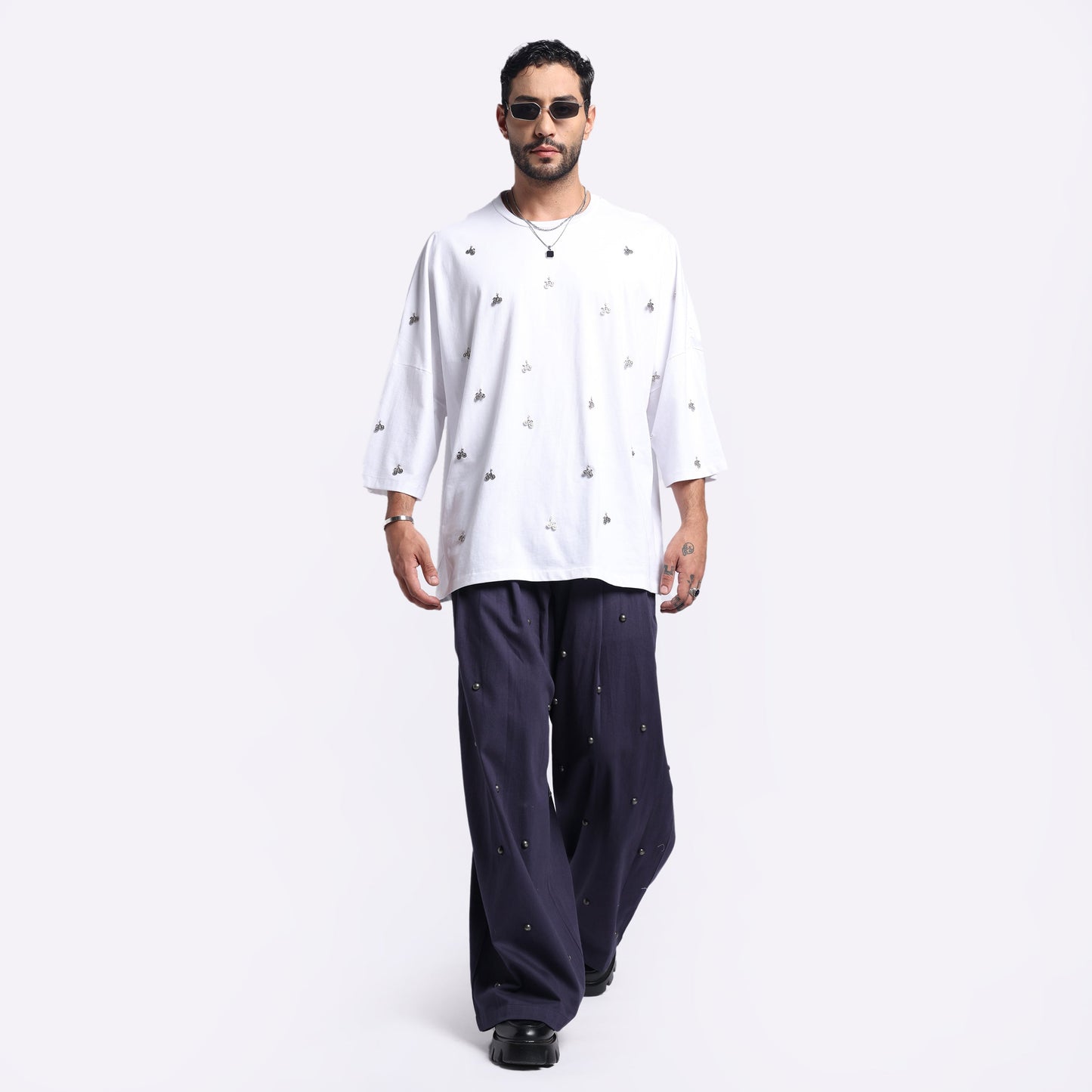 Stylera men's loose fit white t-shirt with unique design, styled for a casual look