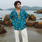 Men's oversized beach shirt by Stylera in turquoise with colorful patterns, perfect for summer outings