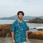 Men's oversized beach shirt by Stylera in teal with colorful ocean-themed patterns, ideal for summer outings