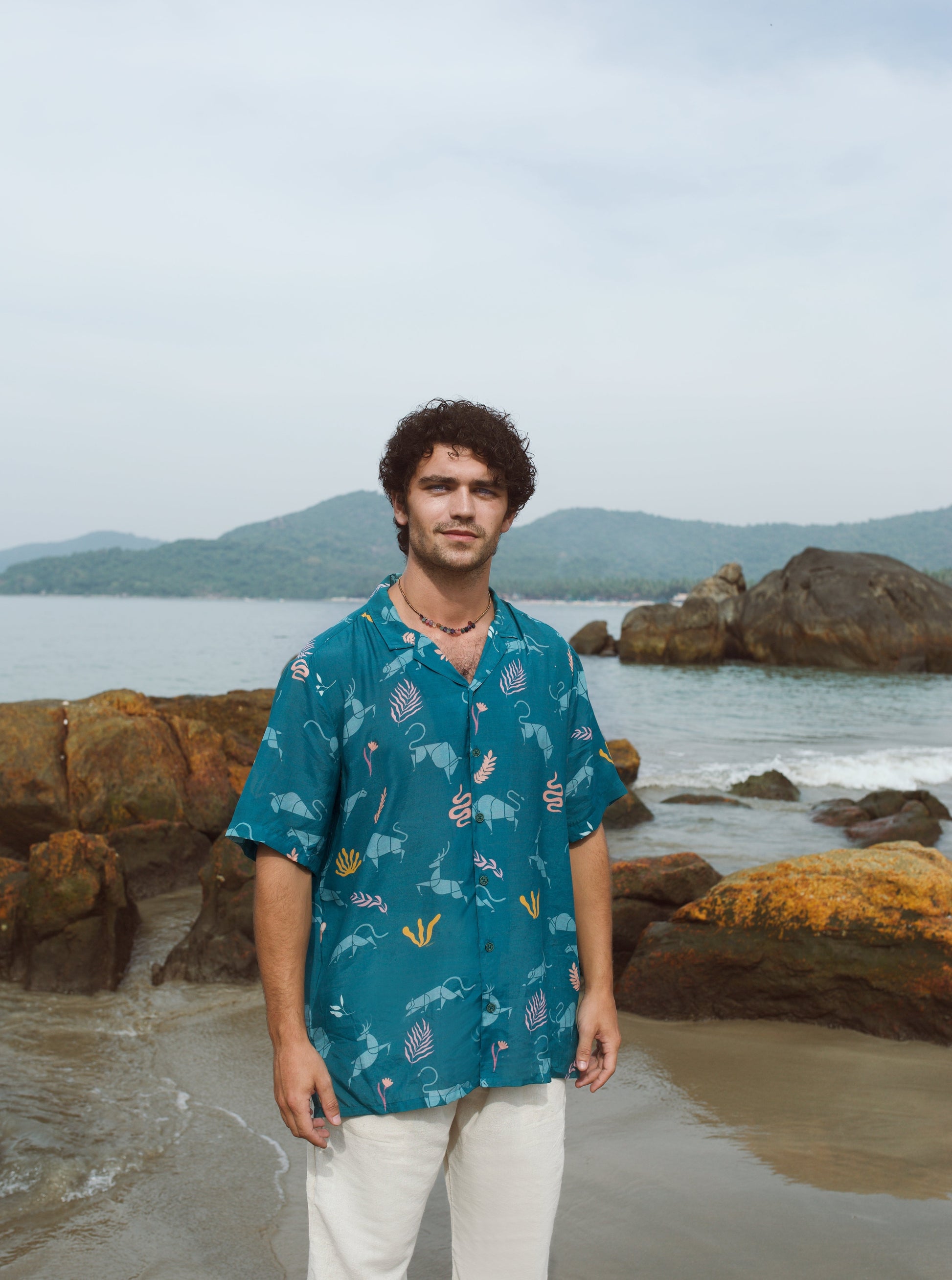 Men's oversized beach shirt by Stylera in teal with colorful ocean-themed patterns, ideal for summer outings
