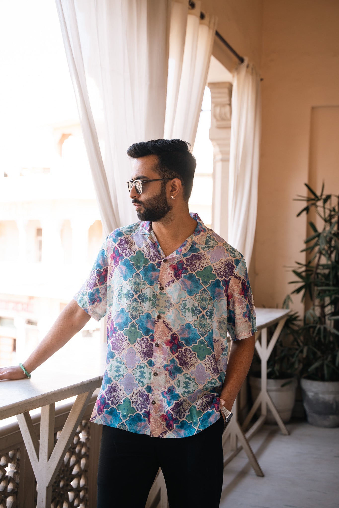 Men's oversized patterned shirt by Stylera in vibrant colors, perfect for casual wear.