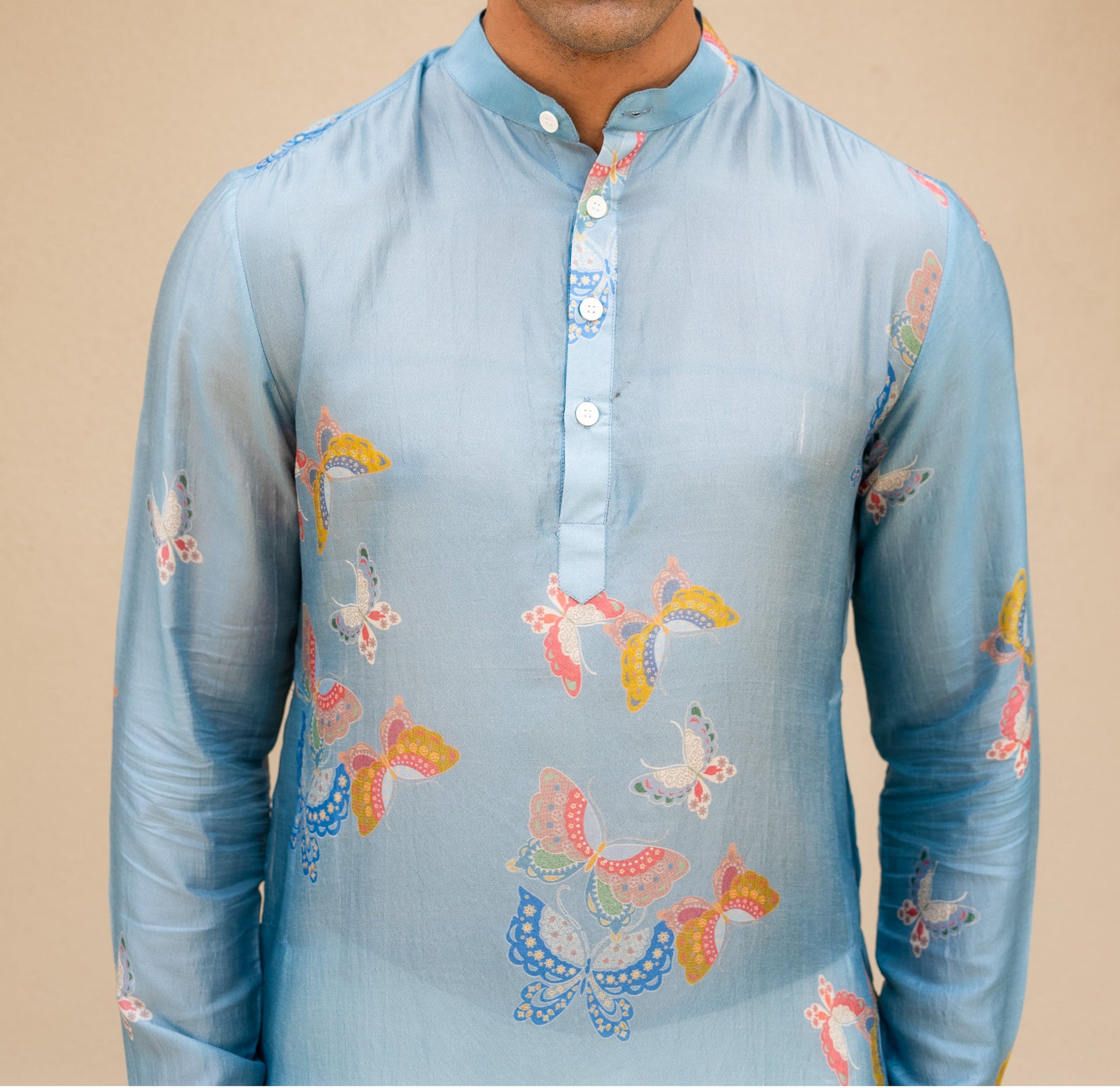 Men's printed kurta with butterfly design in light blue featuring colorful butterfly patterns