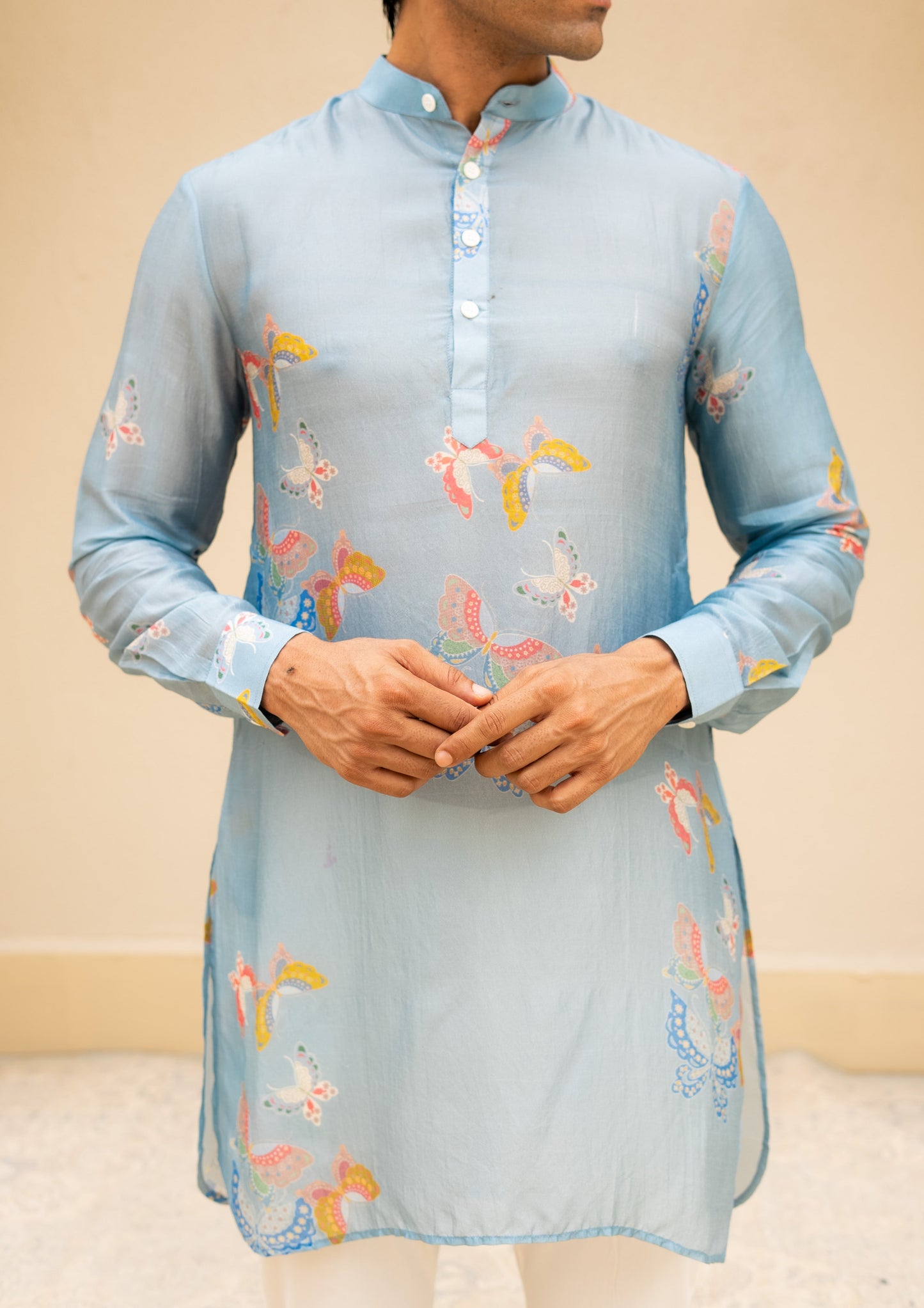 Stylera men's printed kurta with butterfly design in light blue featuring colorful motifs and button details
