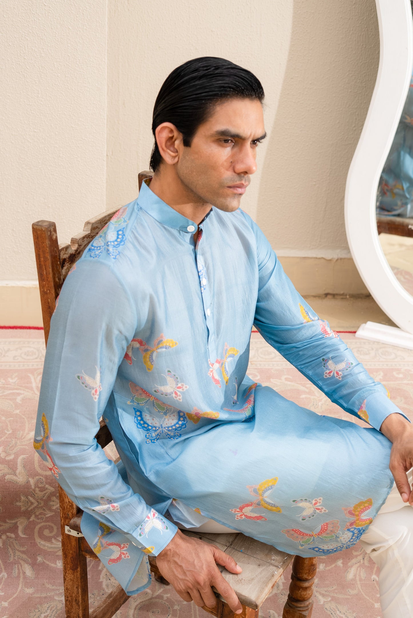 Men's printed kurta with butterfly design in light blue, featuring intricate floral patterns for a stylish look