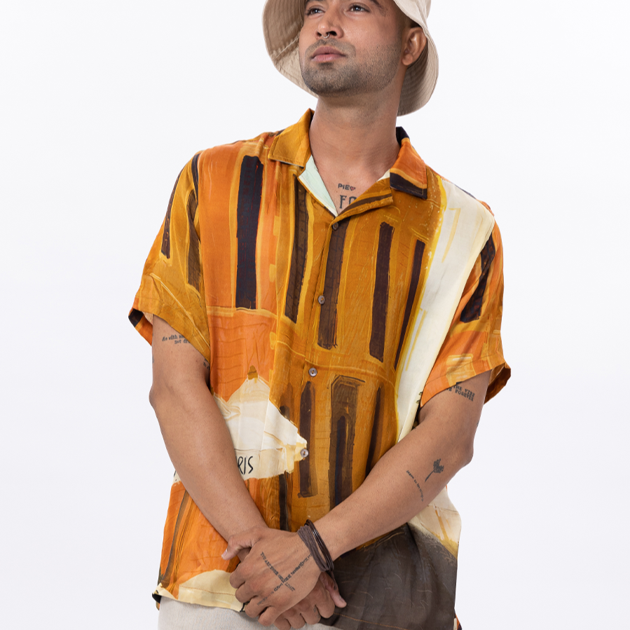 Stylera men's printed short sleeve shirt in vibrant orange and yellow with abstract patterns