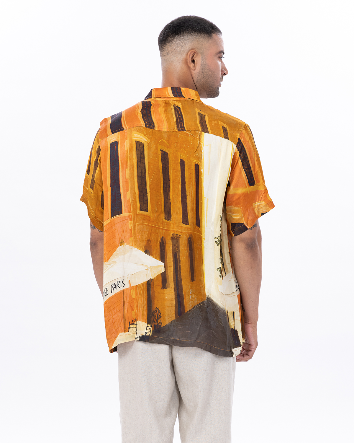 Stylera men's printed short sleeve shirt featuring a vibrant urban design in warm colors