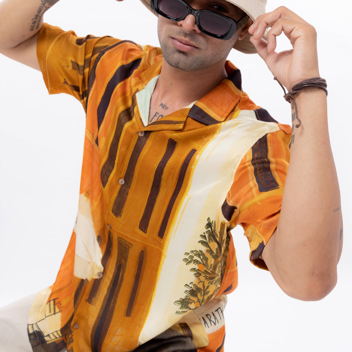 Stylera men's printed short sleeve shirt in vibrant orange with artistic patterns for a stylish summer look