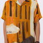 Stylera men's printed short sleeve shirt featuring a vibrant orange artistic design inspired by Paris architecture
