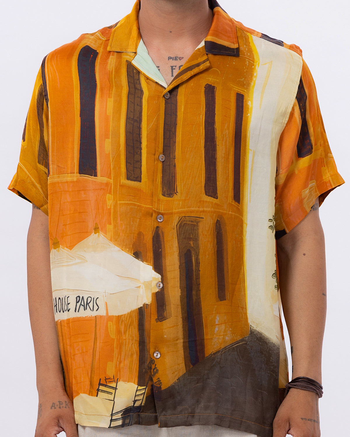 Stylera men's printed short sleeve shirt featuring a vibrant orange artistic design inspired by Paris architecture