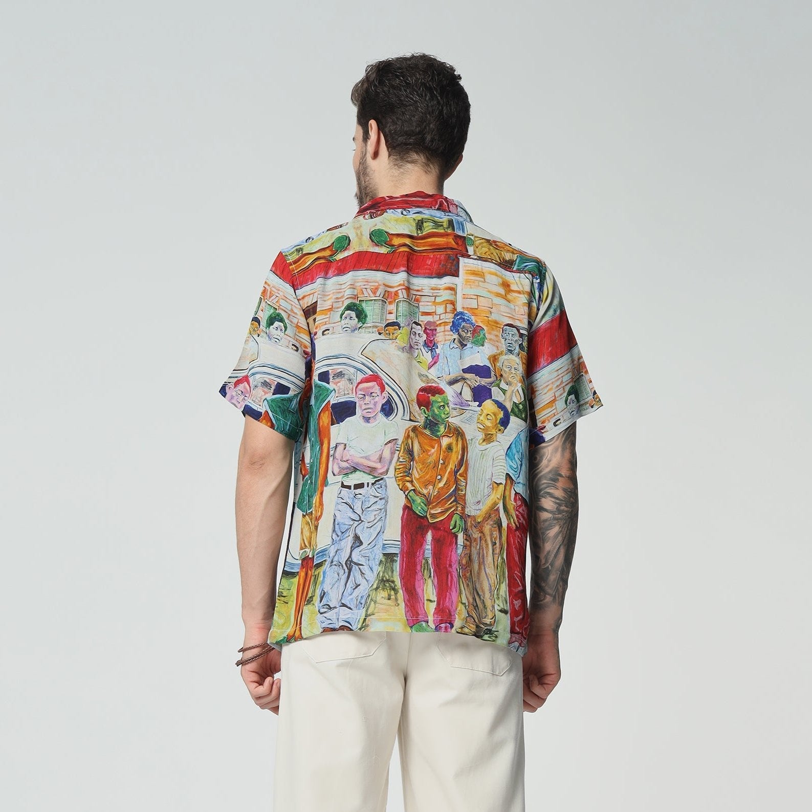 Men's printed short sleeve shirt with vibrant artwork featuring diverse figures and colors