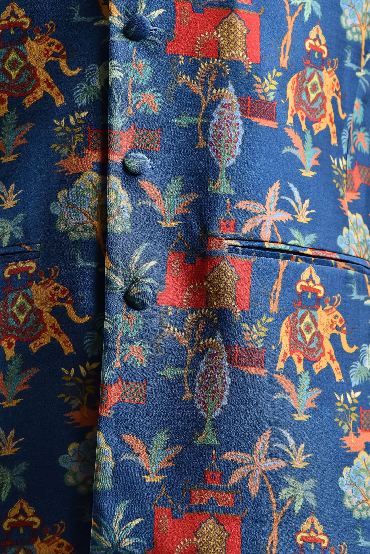 Men's printed silk Nehru jacket with vibrant colorful patterns featuring elephants and trees