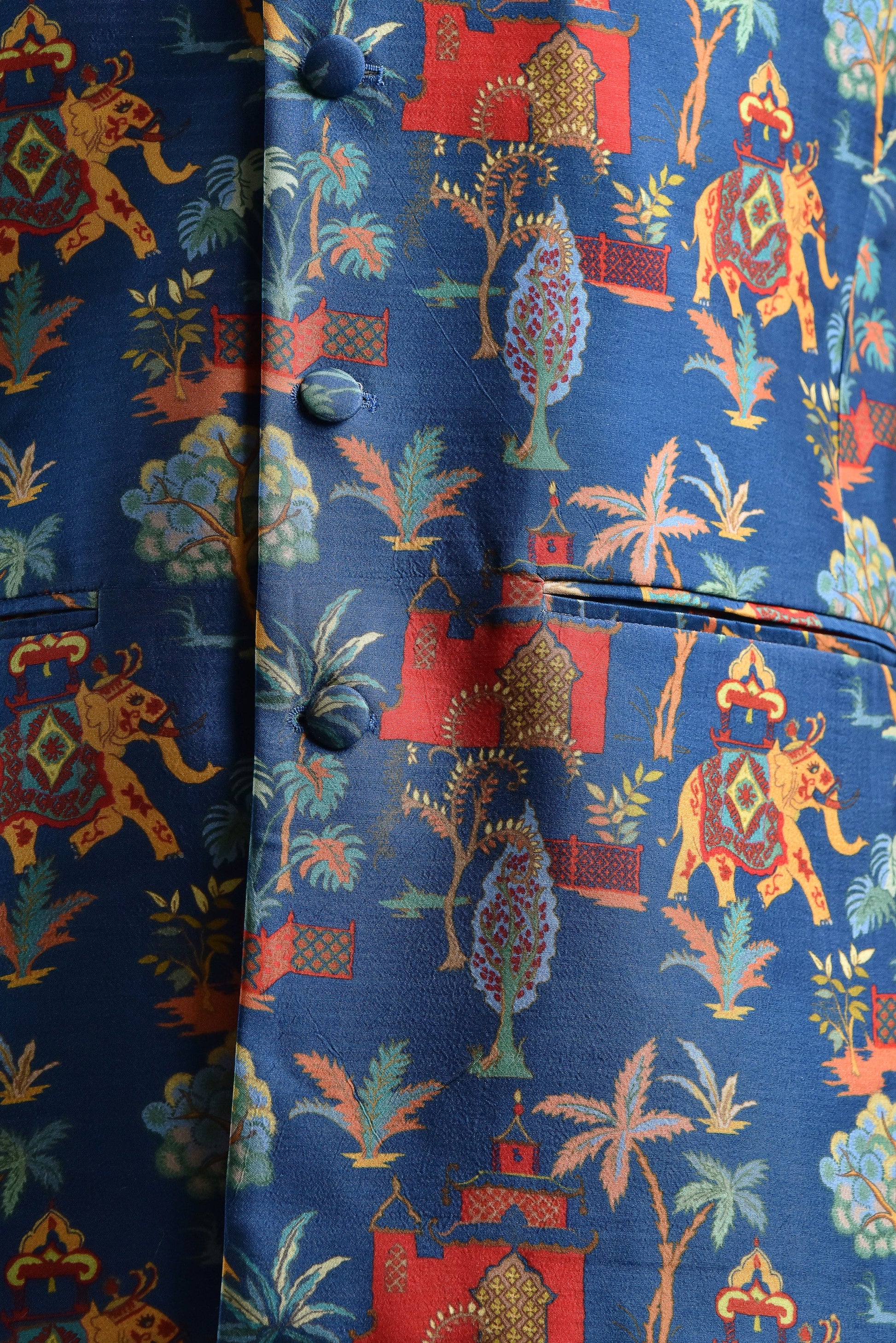 Men's printed silk Nehru jacket with vibrant colorful patterns featuring elephants and trees