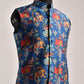 Men's printed silk Nehru jacket featuring vibrant floral and animal patterns on a blue background