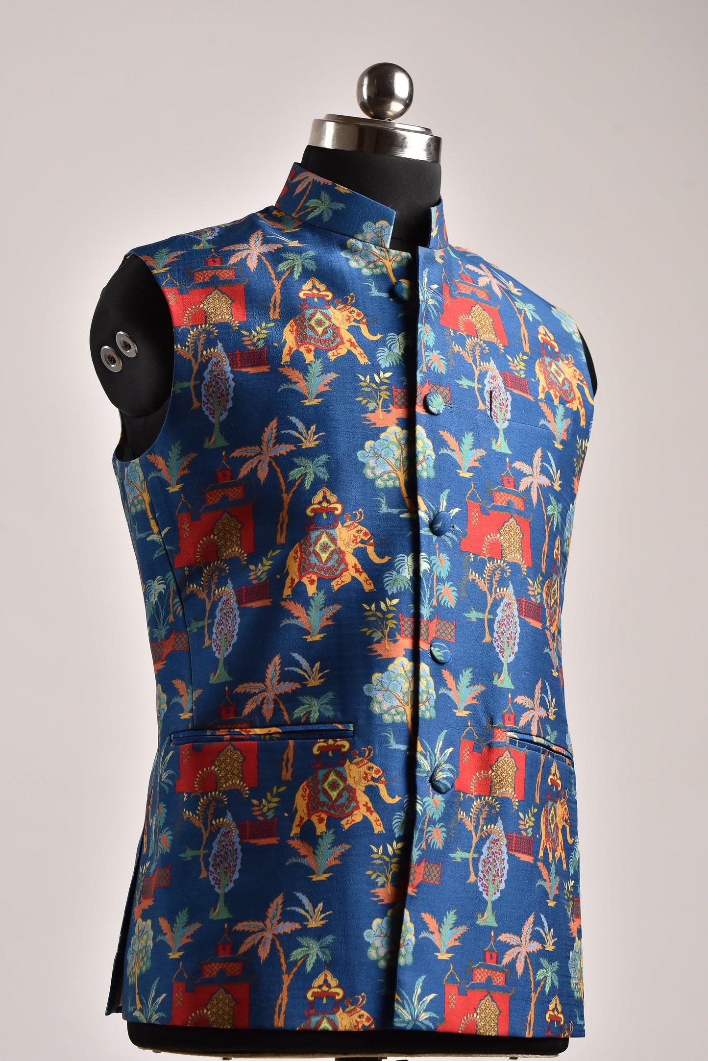 Men's printed silk Nehru jacket featuring vibrant floral and animal patterns on a blue background