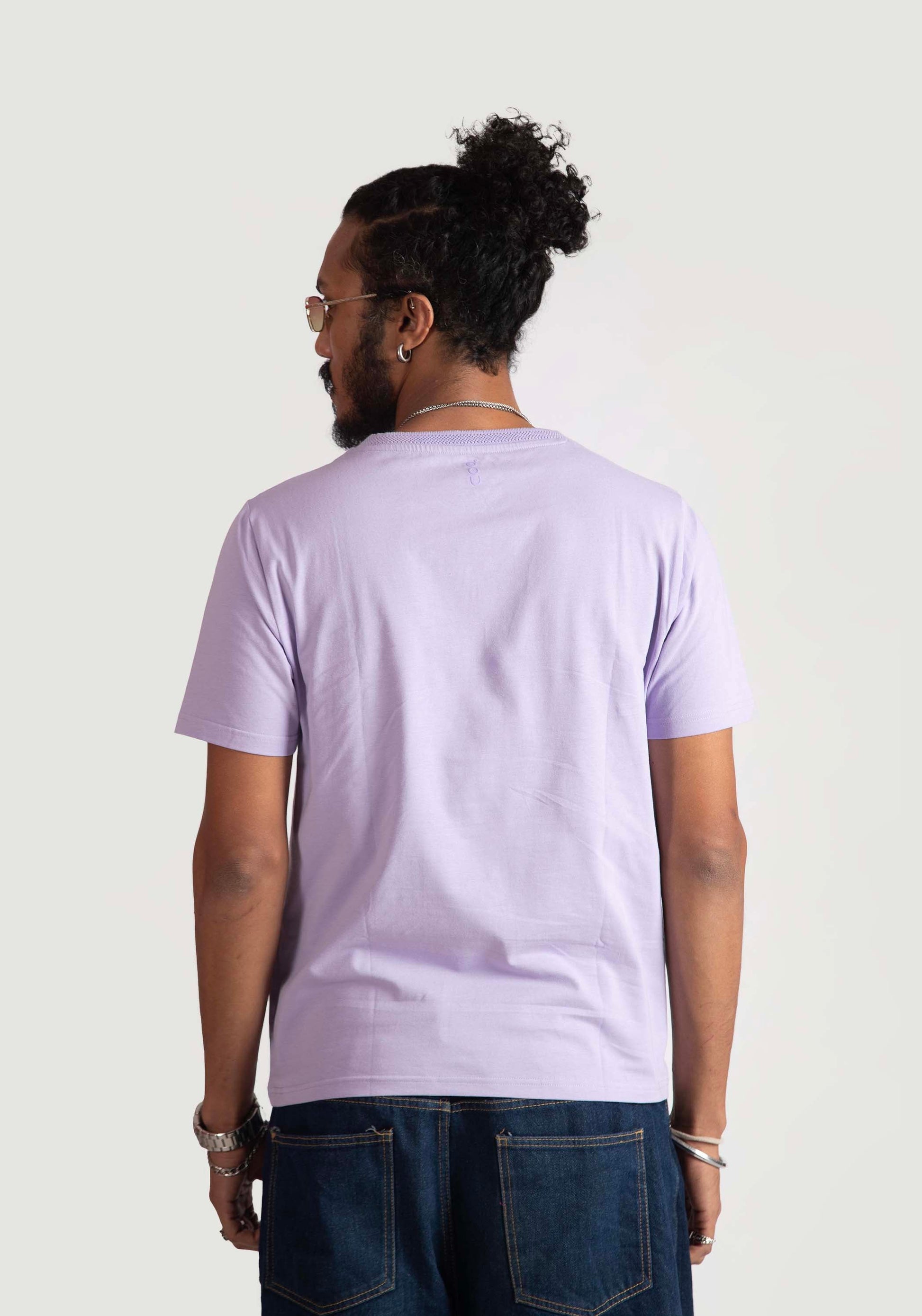 Stylera men's regular fit lavender tee shown from the back on a model with casual jeans