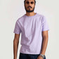 Man wearing Stylera men's regular fit lavender tee paired with dark jeans and sunglasses