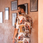 Men's statement oversized shirt with artistic prints displayed in a stylish setting