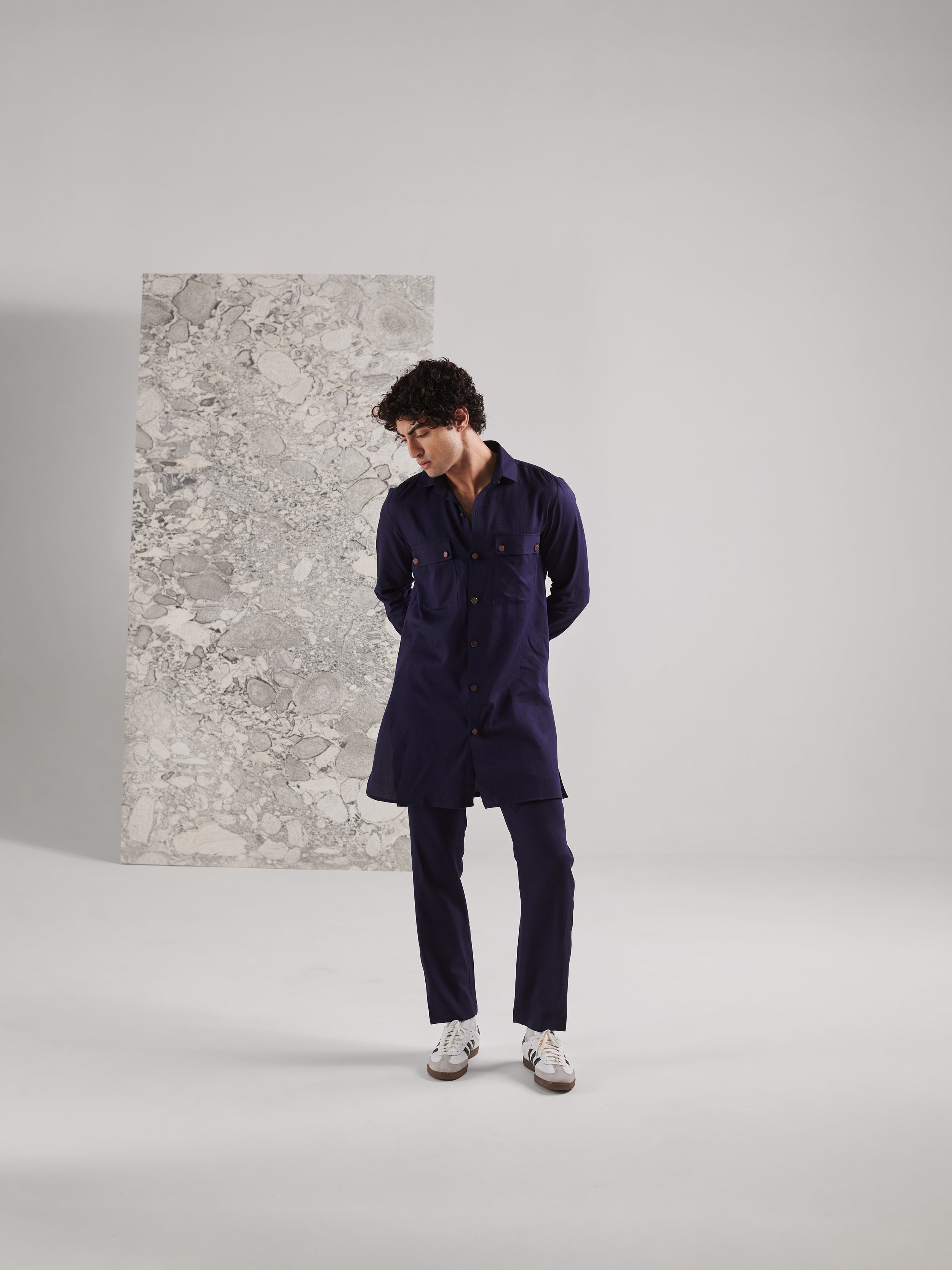 Men's traditional kurta pant set in navy blue with a relaxed fit and stylish pockets