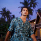 Men's trendy oversized button up shirt by Stylera in blue with abstract patterns, perfect for casual outings